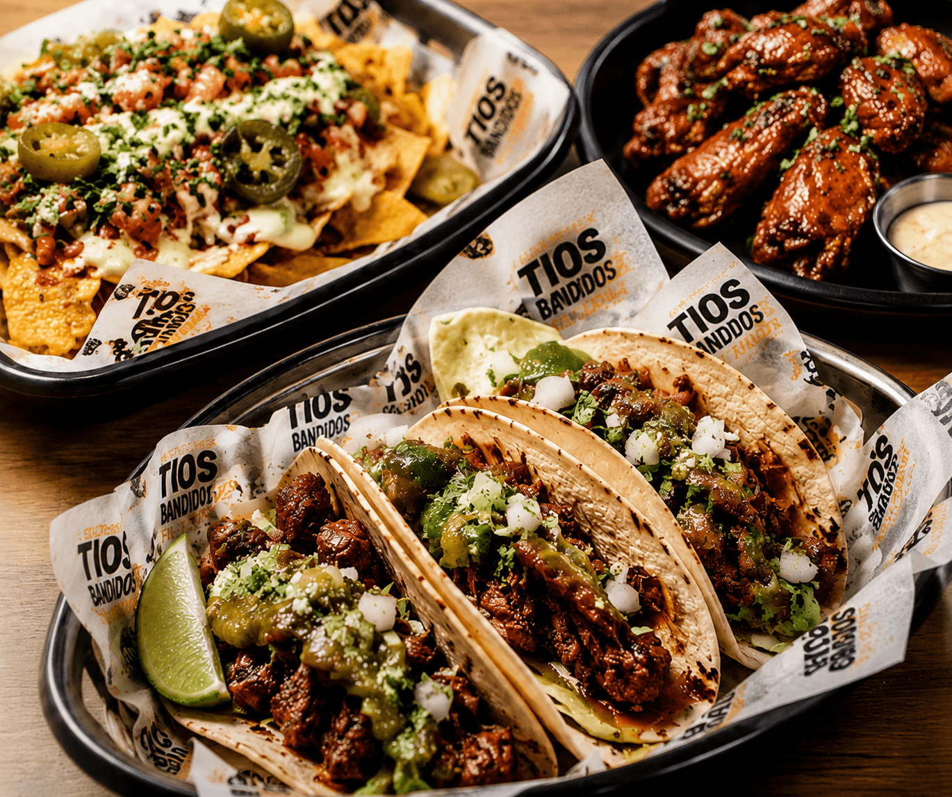 Tios Bandidos tacos, nachos, and wings spread